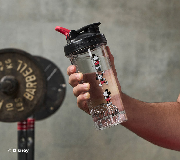 pro-series-d3 Mickey_Mouse_Protein_Shaker_Bottle_Being_Held_In_the_Gym.jpg